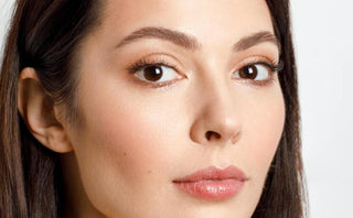 Girl showing her face after using Kass Brightening Serum
